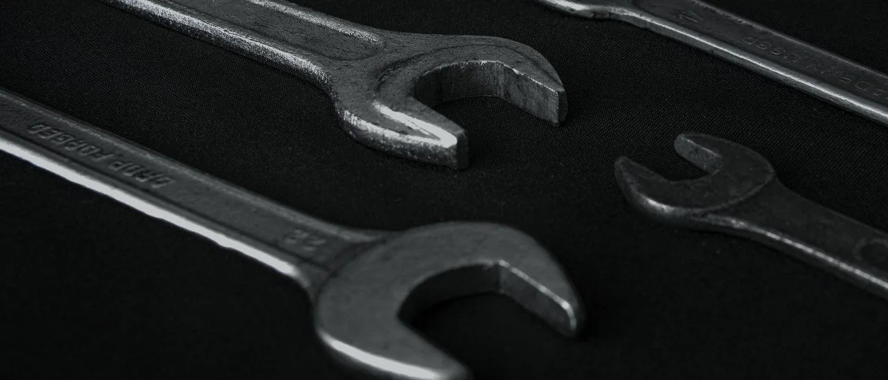 Open-ended spanners arranged on a dark surface